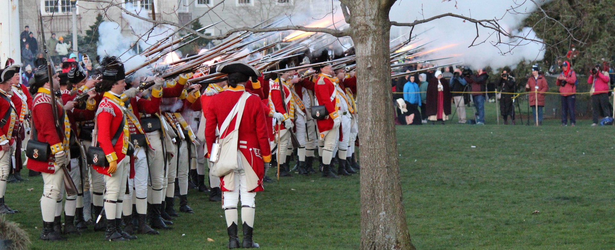 PG Calc "Ready, FIRE, Aim!" - planned giving marketing white paper - image of 18th Century British soldiers firing muskets in a Lexington, Massachusetts reenact PG Calc "Ready, FIRE, Aim!" - planned giving marketing white paper - image of 18th Century British soldiers firing muskets in a Lexington, Massachusetts reenact
