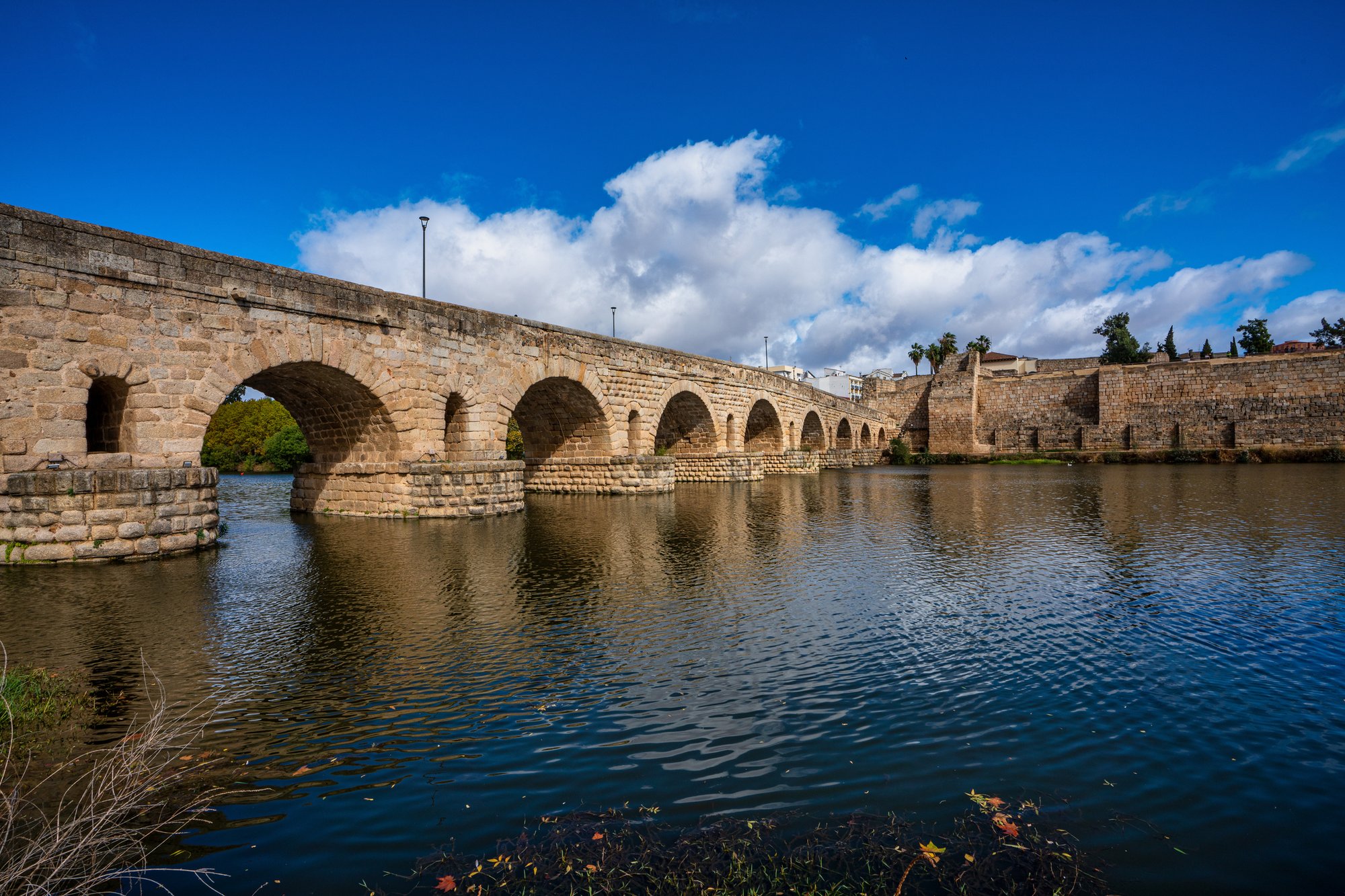 image of a Roman bridge with multiple spans of stone arches